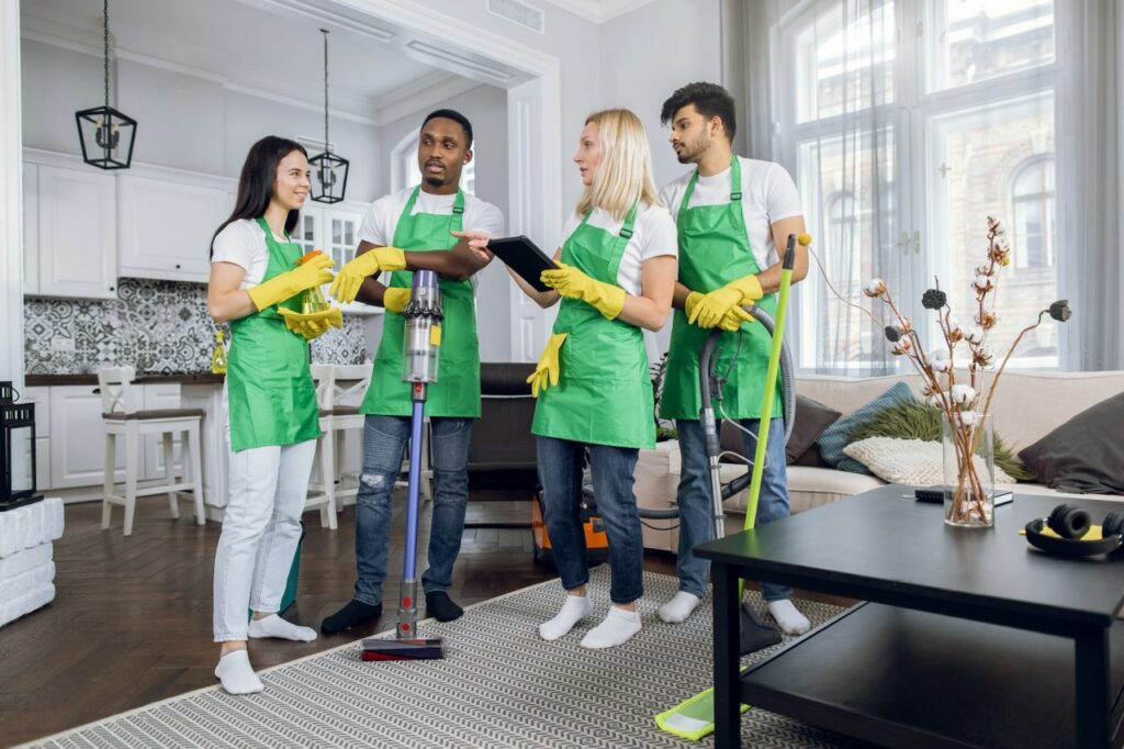 multiracial-team-of-cleaning-service-using-digital-tablet.jpg