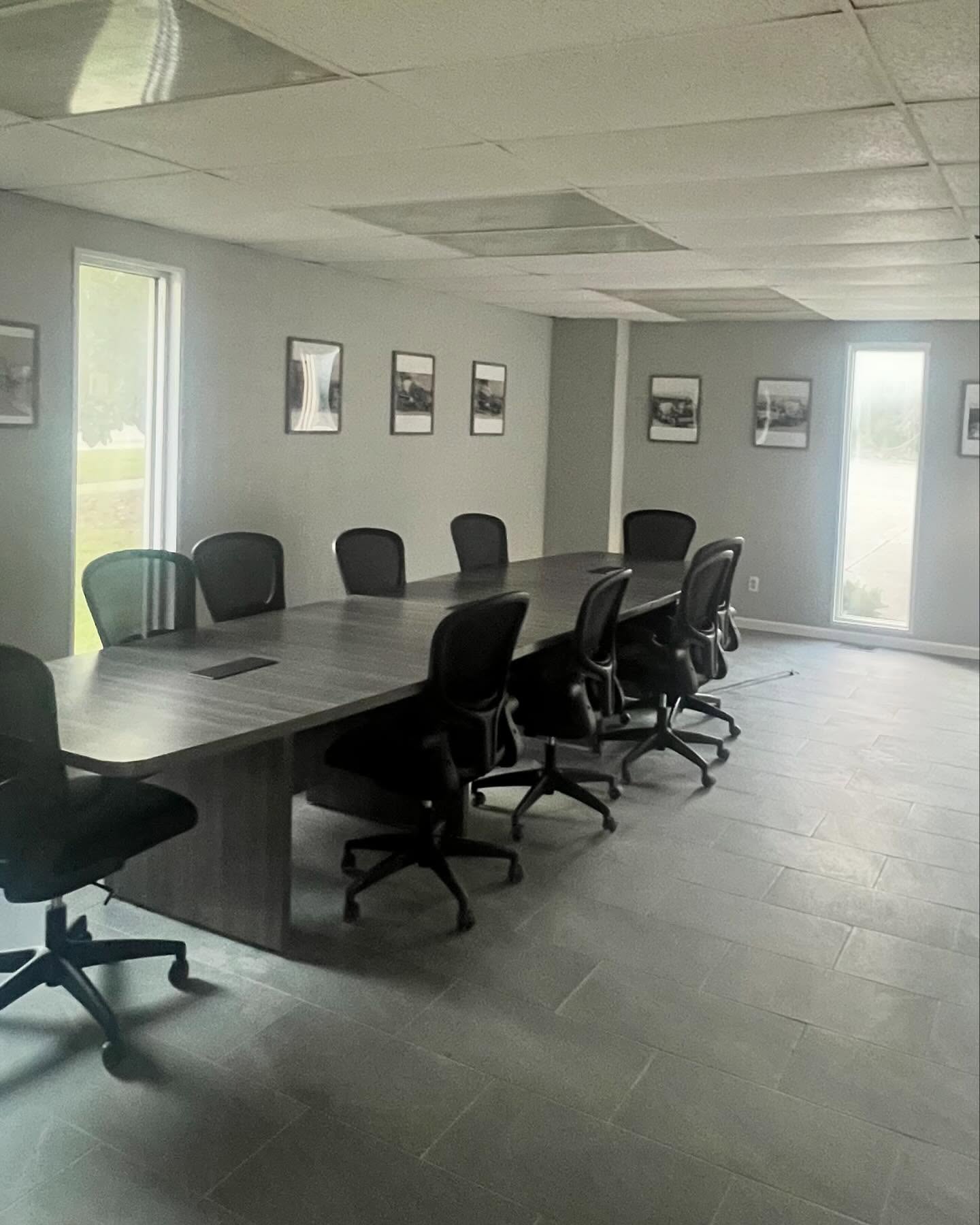 Red 3 Offices and Corporate Buildings Cleaning Services An empty clean conference room with empty chairs.