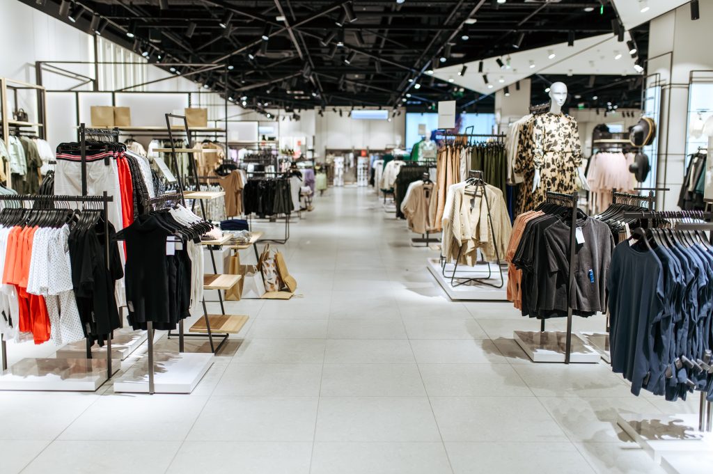 clothes choice in clothing store nobody 2024 11 27 22 29 26 utc Retail Stores and Shopping Centers Cleaning Services An empty clean retail space with clothes organized on racks