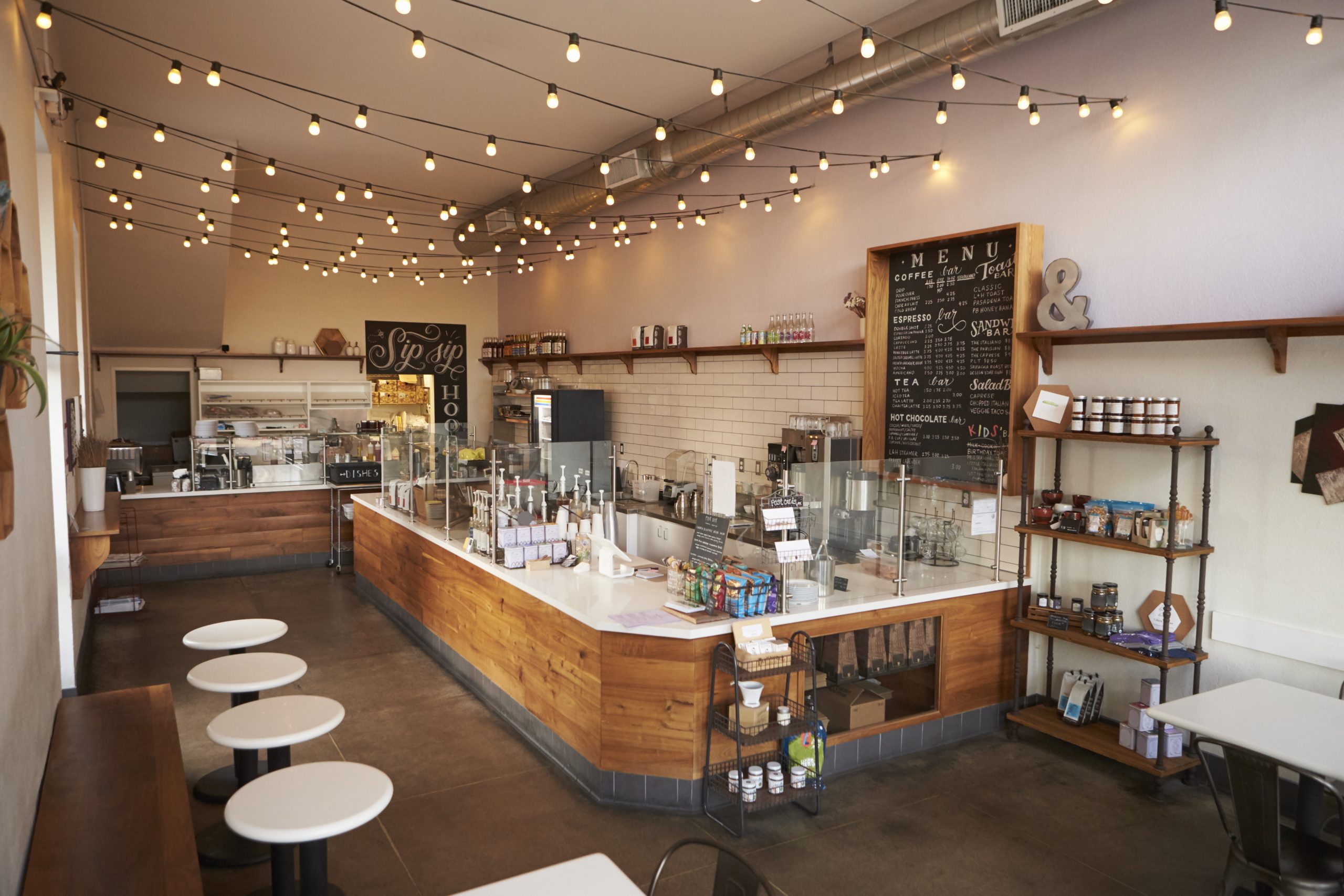 empty cafe or bar interior daytime 2024 10 19 12 37 09 utc scaled Retail Stores and Shopping Centers Cleaning Services Interior of an empty coffee shop with empty seats.