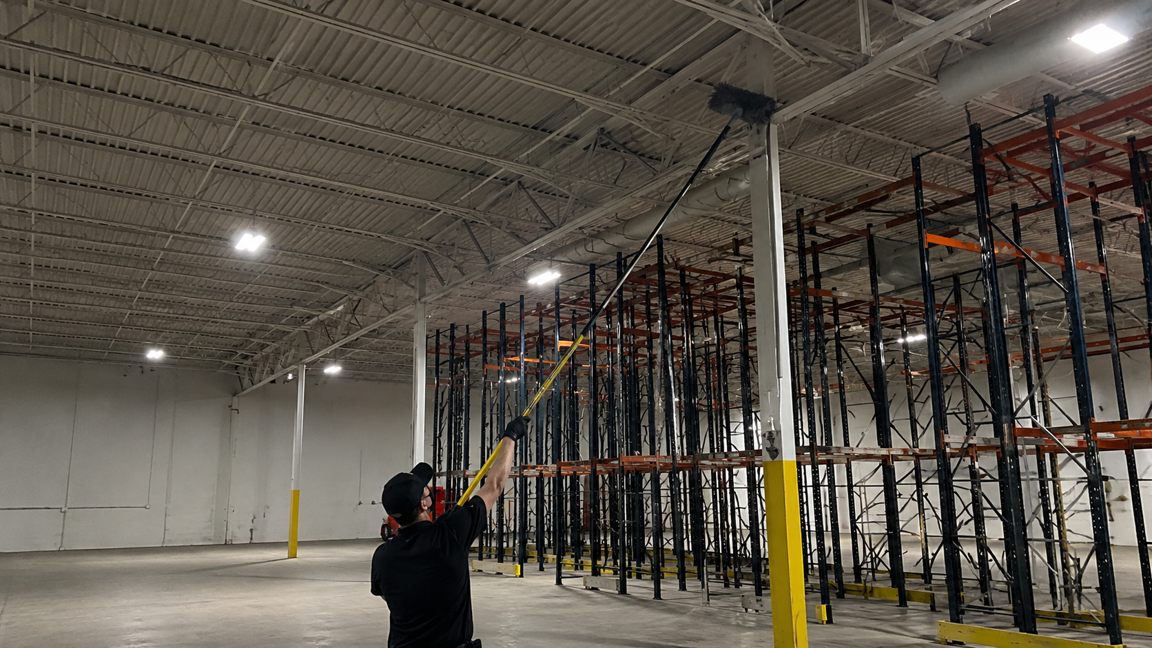 Warehouse rafter and overhead high dusting cleaning in Louisville KY